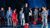 Members-Only-Area-Card A group of young people, dressed in blue, stand on a stage covered in old tarpaulins and red crates. In teh centre a boy in a blue plaid shirt and with long brown hair stands on a red crate singing. To the left of him stands a young boy dressed all in red, staring in front of himself. An image from Garsington Opera's 2023 Youth Company performance of 'The Moon is Listening' by Richard Taylor.