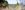 Alice-Pennefather-KISH5290-2018-07-10-1920-aspect-ratio-250-100 A woman crossing the bridge from the Opera Pavilion to the garden, taken through blurred flowers in the foreground