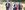 stephen-wright-photography-garsington-opera-2021-90-1920-aspect-ratio-250-100 A group of people walking in evening wear down a mown grass path
